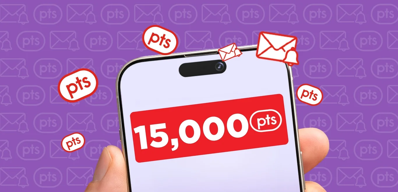 A hand holds up a smartphone containing "15,000 PC Optimum points" surrounded by red PC Optimum points pucks